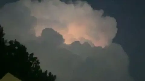 Clouds aglow with an otherworldly light.